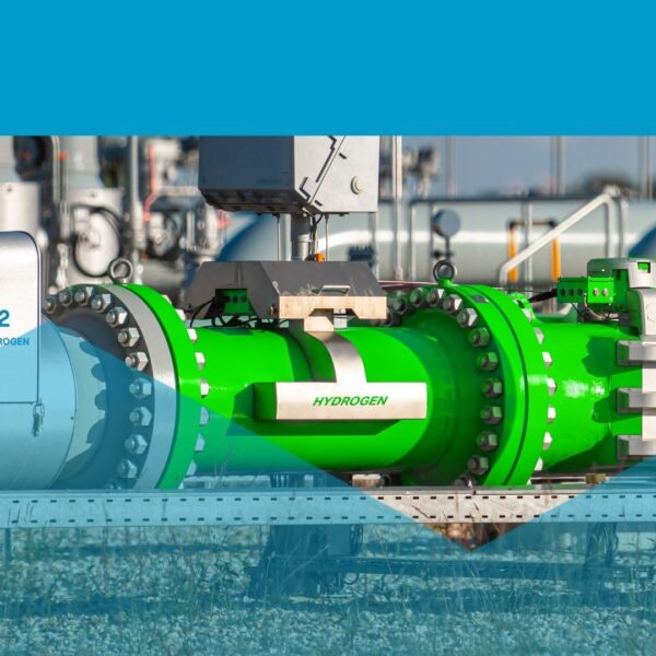 Green hydrogen pipeline and industrial infrastructure at a clean-energy facility, labelled "H2 Green Hydrogen".